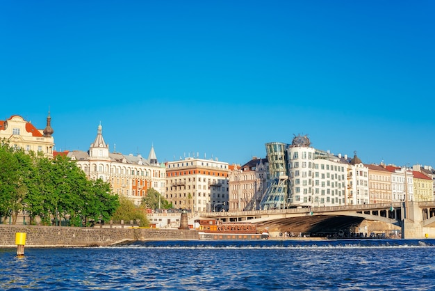 View of Jirasek Bridge over Vltava river and Prague cityscape. Czech Republic