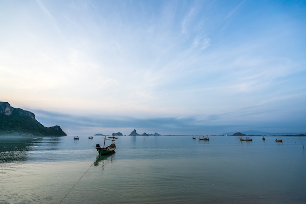 View of Khao Ta Mong Lai Forest Park with a boat in the sea