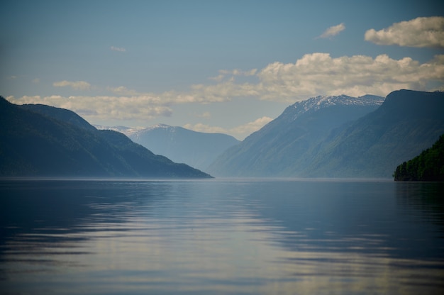 View of lake Teletskoye and the surrounding mountains from the village of Artybash. Turochaksky district, Altai Republic, South of Western Siberia, Russia.