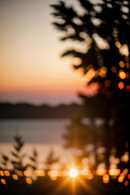 Photo a view of a lake with a tree and the sun setting behind it