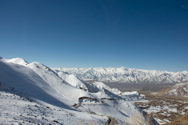 View landscape with Himalayas mountains range between Khardung La road pass go to Nubra Valley in Hunder city while winter season at Leh Ladakh in Jammu and Kashmir India