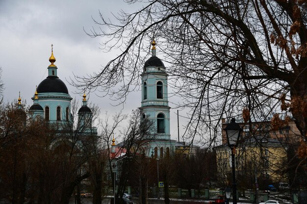 View of the large church and the bell tower building. City panorama.