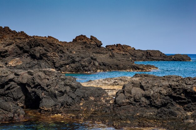 View of the lava beach of Linosa Called Mannarazza, Sicily. Italy