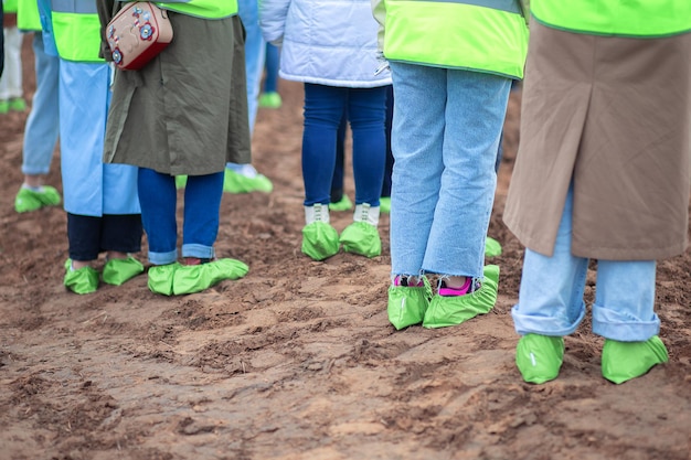 View of legs in reusable shoe covers. Environmental shoe covers.