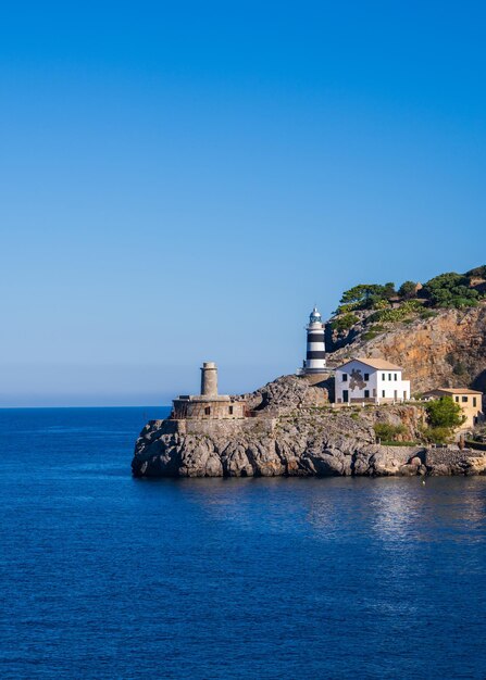 View of the lighthouse at the entrance to Soller Bay Port de Soller Mallorca Spain Famous tourist destination