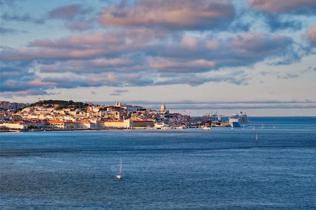 View of Lisbon view over Tagus river with yachts and boats on sunset Lisbon Portugal