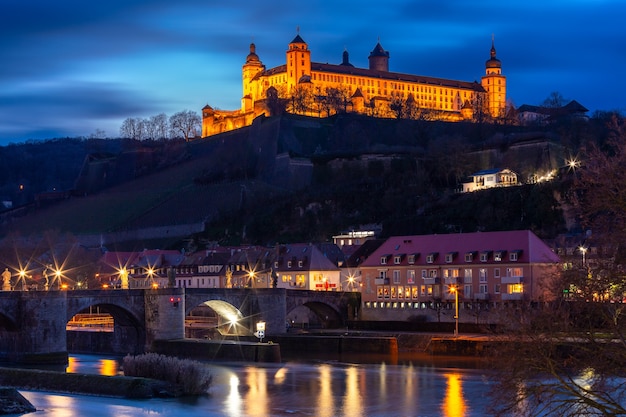 View of Marienberg Fortress and Old Main Bridge, Alte Mainbrucke in Wurzburg at night, Bavaria, Germany