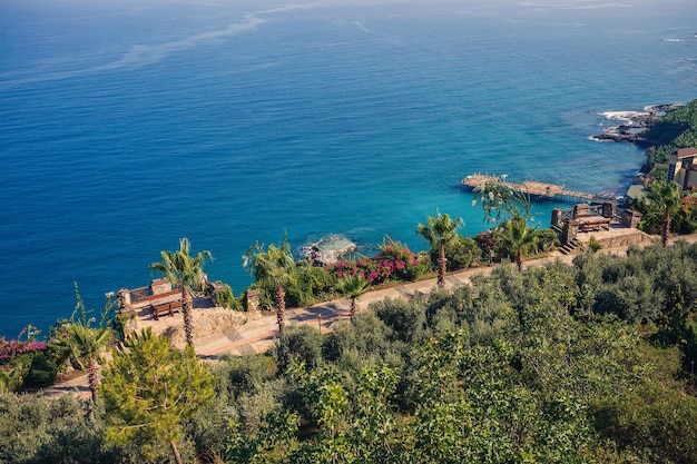 A view of the Mediterranean coast with waves of azure water Summer seascape Seaside in sunny weather Beautiful sea view