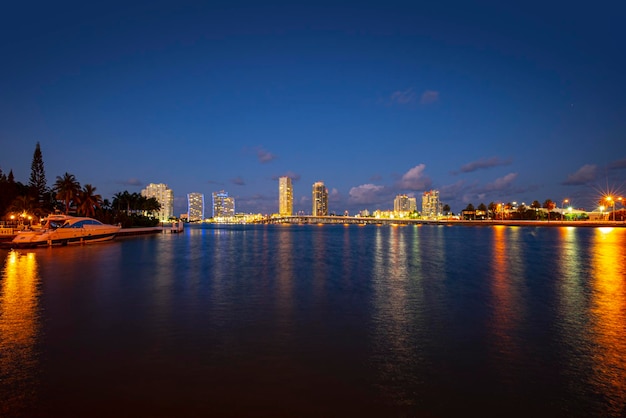 View of miami at sunset usa miami city skyline panorama at dusk with urban skyscrapers and bridge ov