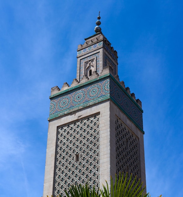 View of the Minaret of the Grand Mosque on the blue sky Paris