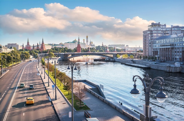 View of the Moskva River and the Moscow Kremlin from the Patriarchal Bridge in the morning sun. Inscription: Variety Theater
