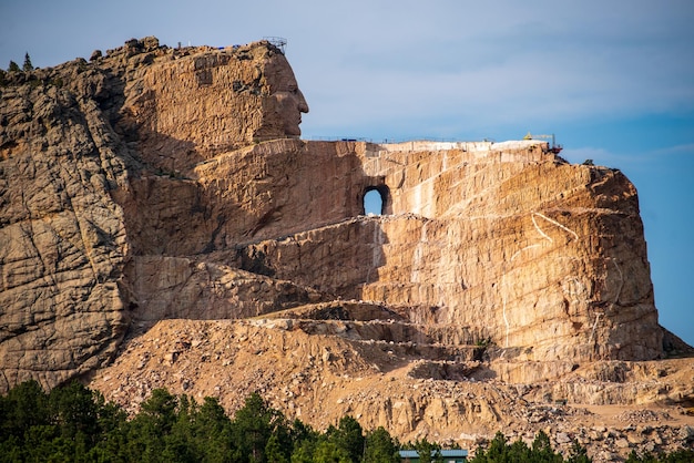 View of the mountain monument Crazy Horse Memorial under the blue sky