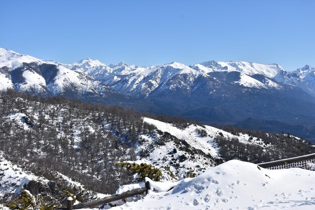 a view of a mountain range with a house in the background