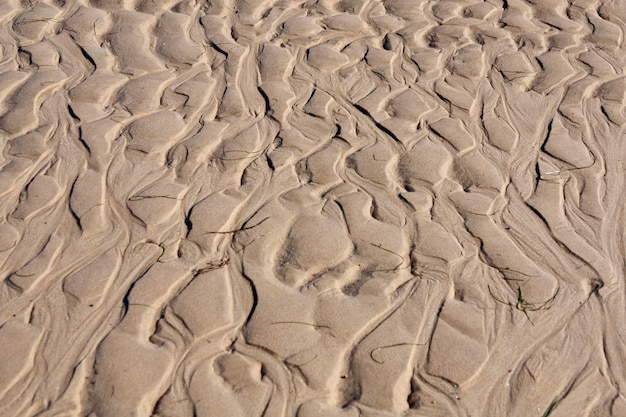 View of natural ripples made by the tide on the sand.