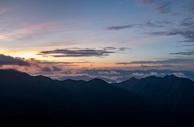 View of nature. The top of the mountain, the sun, the mist and the mountain.