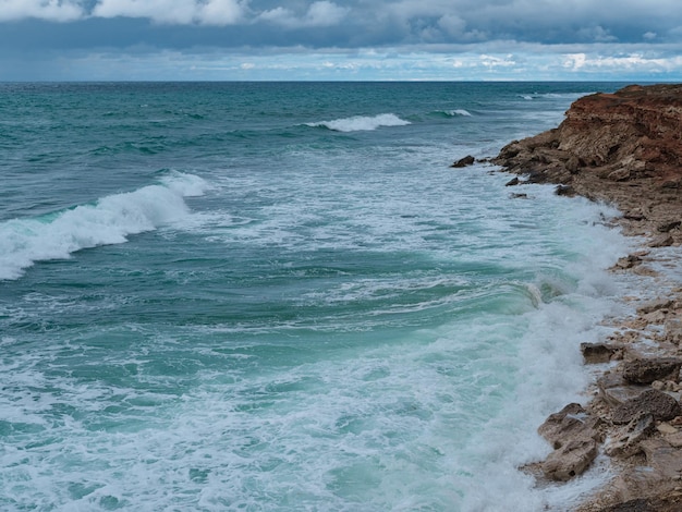 View of ocean waves and a fantastic rocky shore