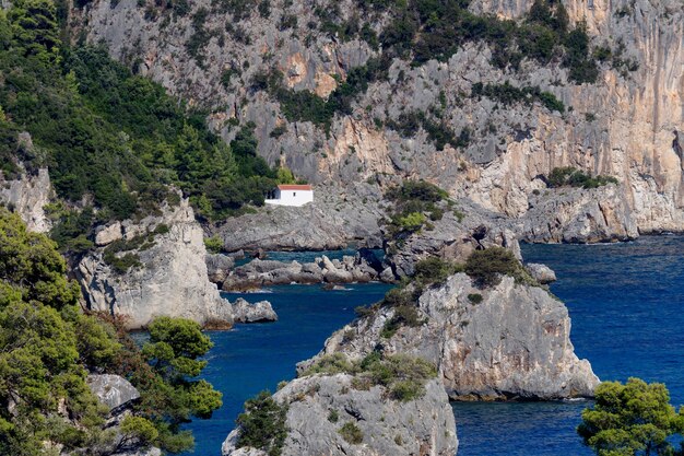 View of the Orthodox Christian Church of the Mother of God on a small island in a sunny summer day resort city Parga region of Epirus Greece