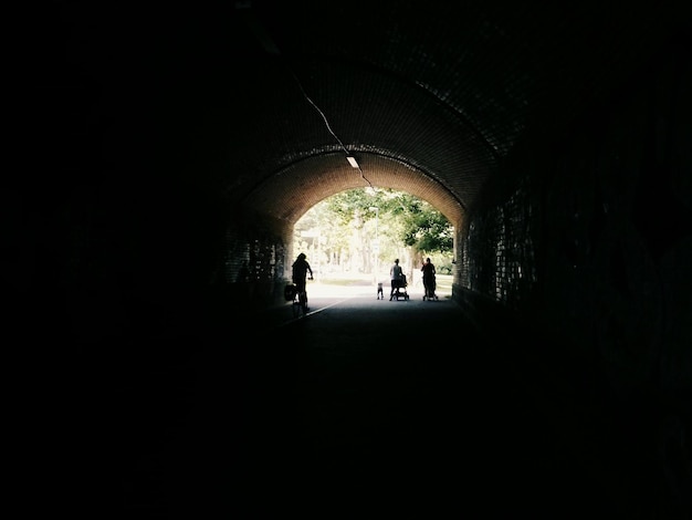 View of people walking out of tunnel