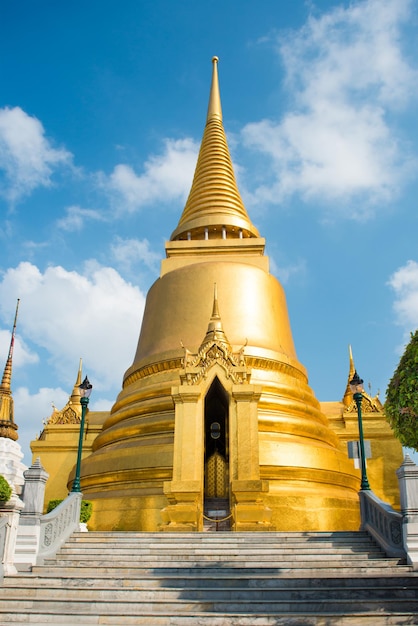 View of Phra Si Rattana Chedi gold stupa near Temple of Emerald Buddha Grand Palace Bangkok Thailand