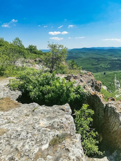 View of the picturesque Crimean mountains from the cave town of TepeKermen in summer May 2021 Crimea Russia