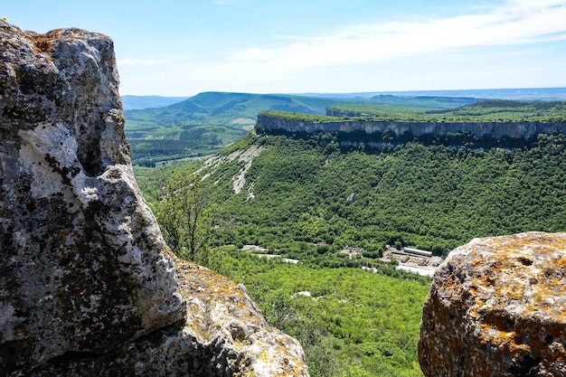 View of the picturesque Crimean mountains from the cave town of TepeKermen in summer May 2021 Crimea Russia