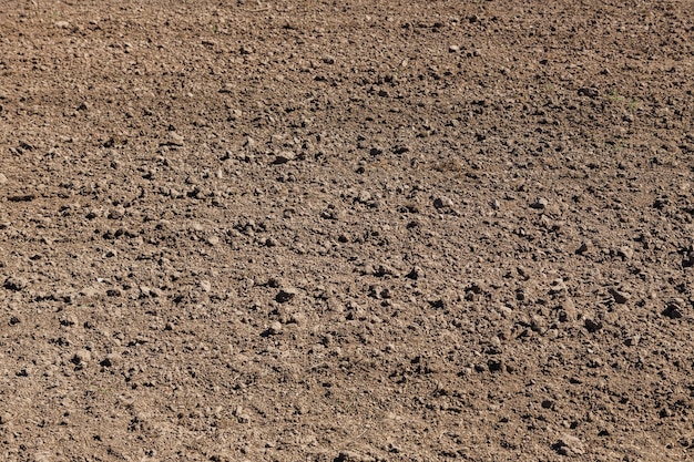 View of plowed agriculture field Brown agricultural soil field