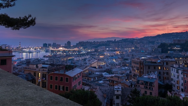 View of the port of genoa at sunset from spianata castelletto italy