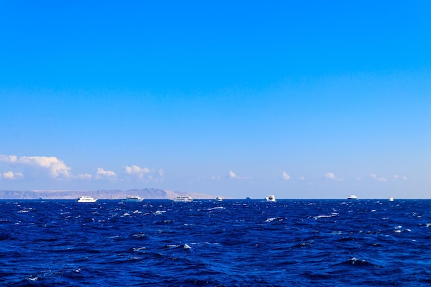 View of Red sea and white yachts on horizon near Hurghada Egypt