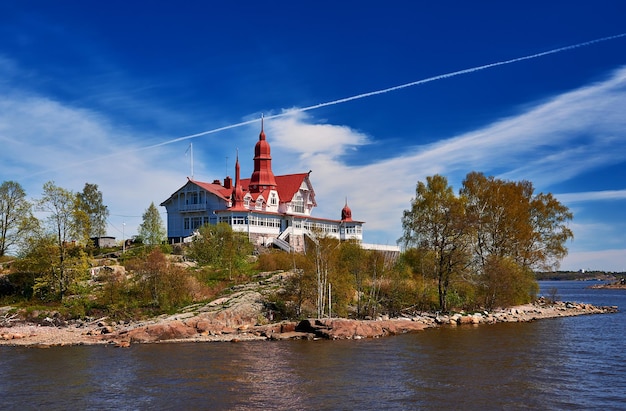 View of river amidst trees and buildings against sky