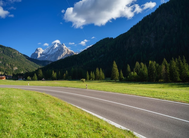 View of the road with turns in the mountain valley The Dolomite Alps Italy Photo in high resolution