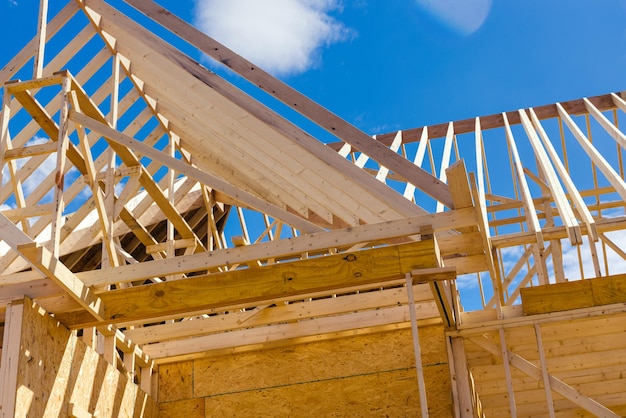 View of roof truss system beams wooden frame the new house under construction