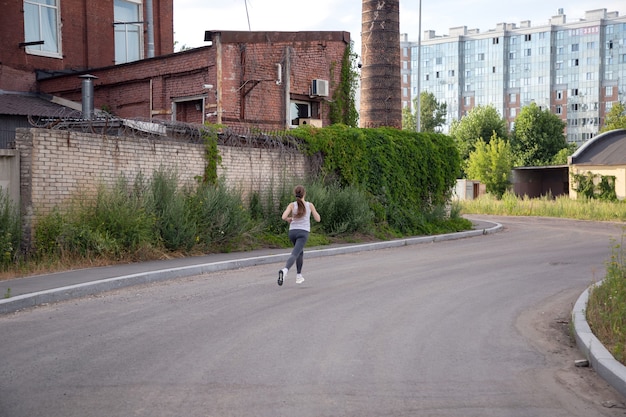 View of a runner in an industrial area