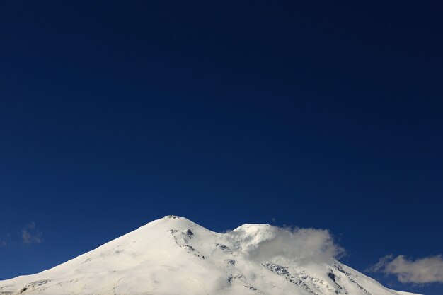 View of the saddle of Mount Elbrus from the north of the Caucasus Mountains in Russia