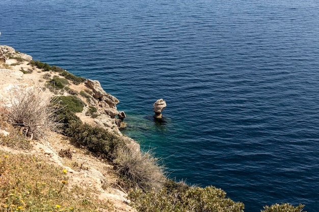 View of the sea beach stone in the water and the sea Greece