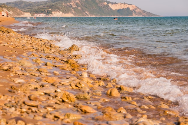 View to the shore with Pebbles and sand in Europe Beach backgroundlandscape coastline with stones on sunny dayrelax coastline sea ocean gulf rock and beach