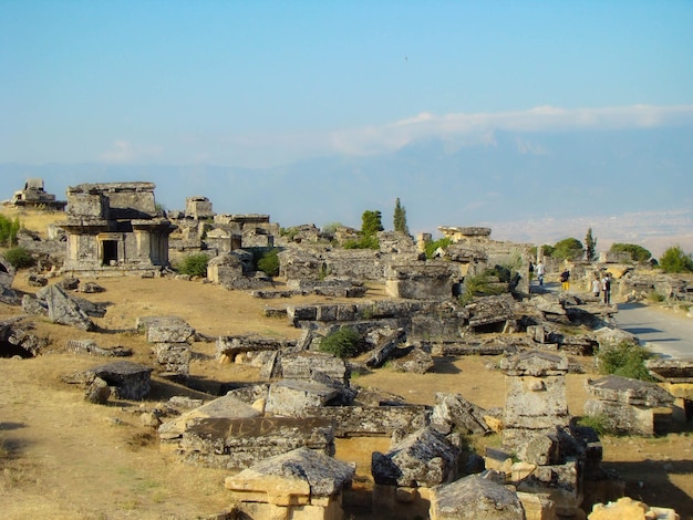 View of the snowwhite travertines of Pamukkale from ancient Hieropolis ruins Turkey