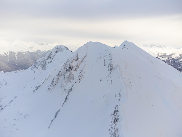 A view of the snowy peak of a mountain in Sochi