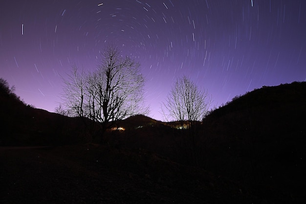 A view of the stars of the Milky Way with a mountain top in the foregroundPerseid Meteor Shower