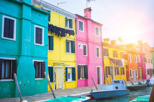 View of streets with colorful houses in burano along canal typical tourist place burano island in