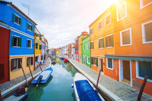 View of streets with colorful houses in burano along canal typical tourist place burano island in