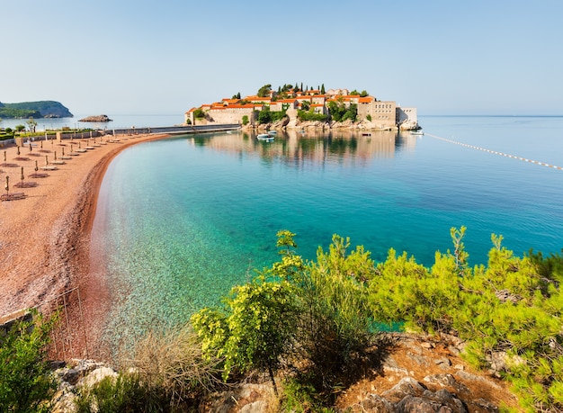 The view of  Sveti Stefan sea islet with pink sandy Milocer Beach (Montenegro, near Budva)