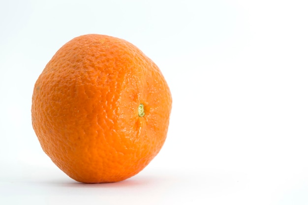 View of a tangerine in lateral position placed on a white background