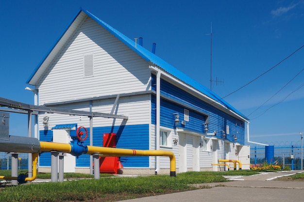 View of territory of gas distribution station from outside on sunny summer day Industrial building New gas supply facilities Transportation of natural gas through pipes