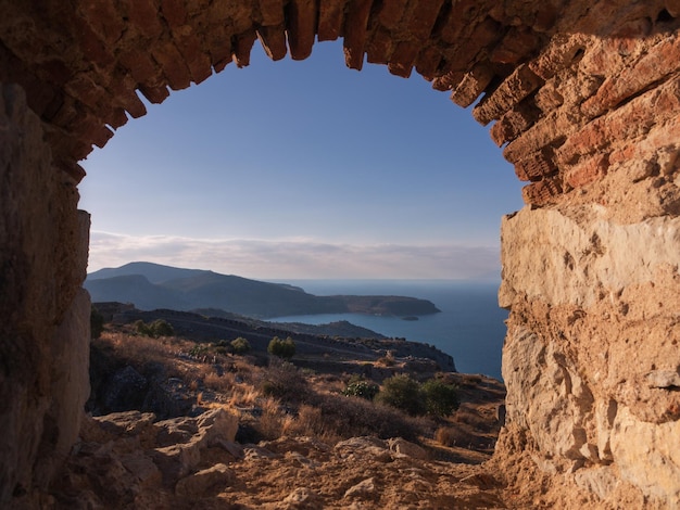 View through window of ruins of ancient Greek fortress Palamidi with vast panoramic view, Greece