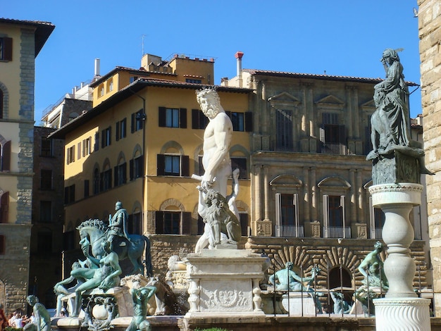 View of the town square and sculpture on a sunny day Florence Italy