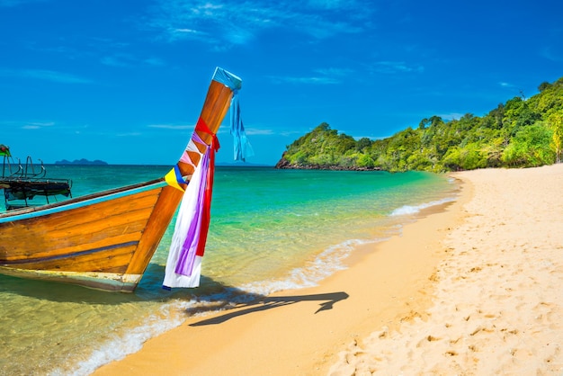 View of traditional thailand longtail boat at sand beach of tropical island in Andaman sea