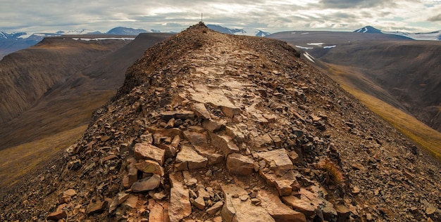 view of the trail going to the mountains to snowcapped peaks