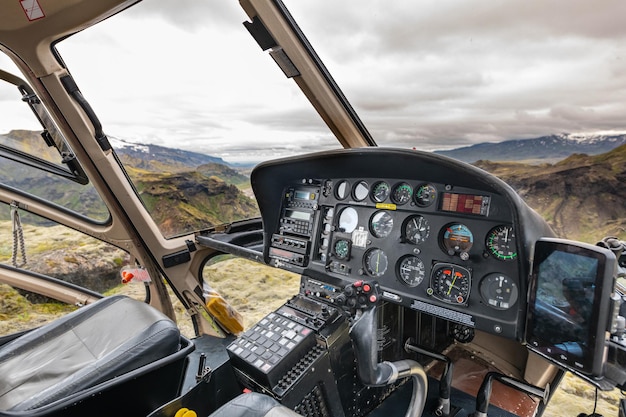 View to a valley next to the Eyjafjallajokull volcano Iceland from a helicopter cockpit