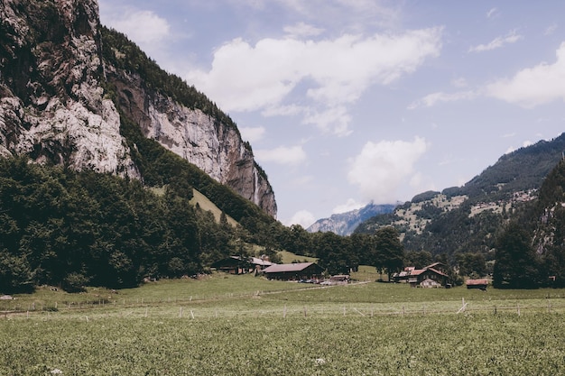 View valley of waterfalls in national park of city Lauterbrunnen, Switzerland, Europe. Summer landscape, sunshine weather, dramatic blue sky and sunny day