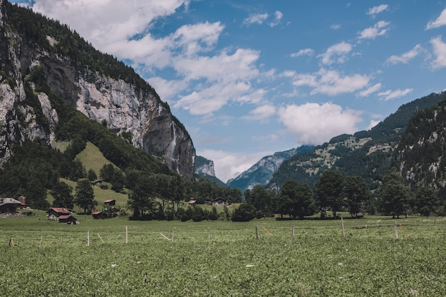 View valley of waterfalls in national park of city Lauterbrunnen, Switzerland, Europe. Summer landscape, sunshine weather, dramatic blue sky and sunny day